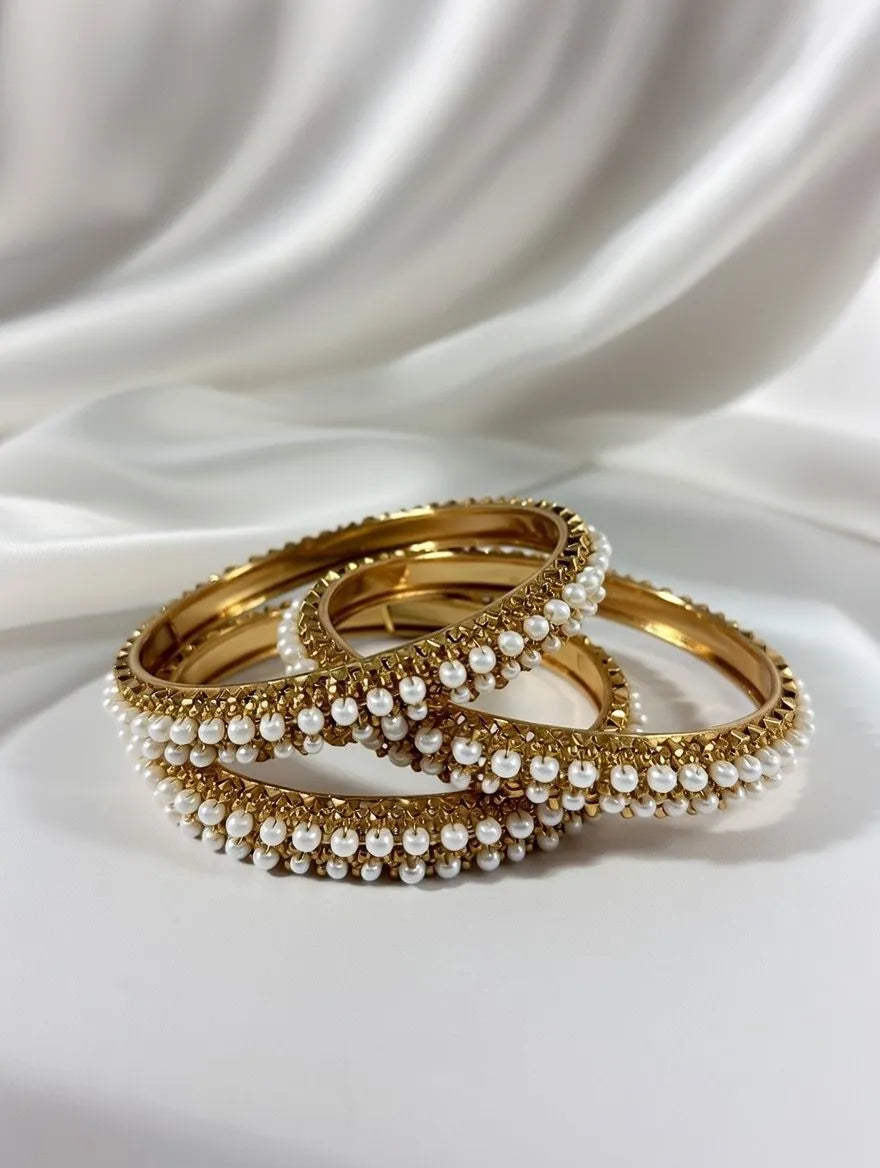 Pair of premium gold-plated bangles for women with white pearl detailing -