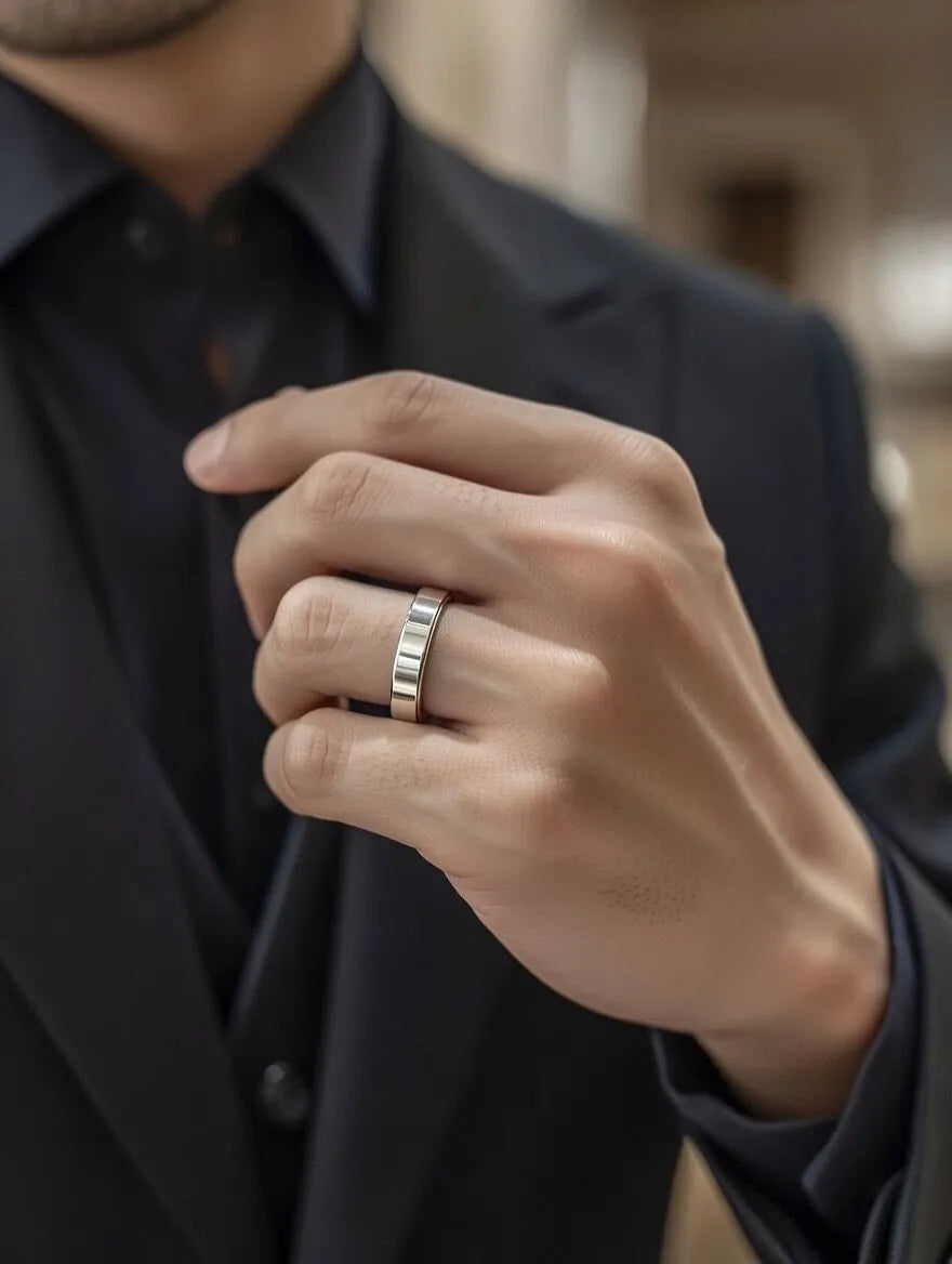 Close-up of a hand wearing a ring with a blurred background