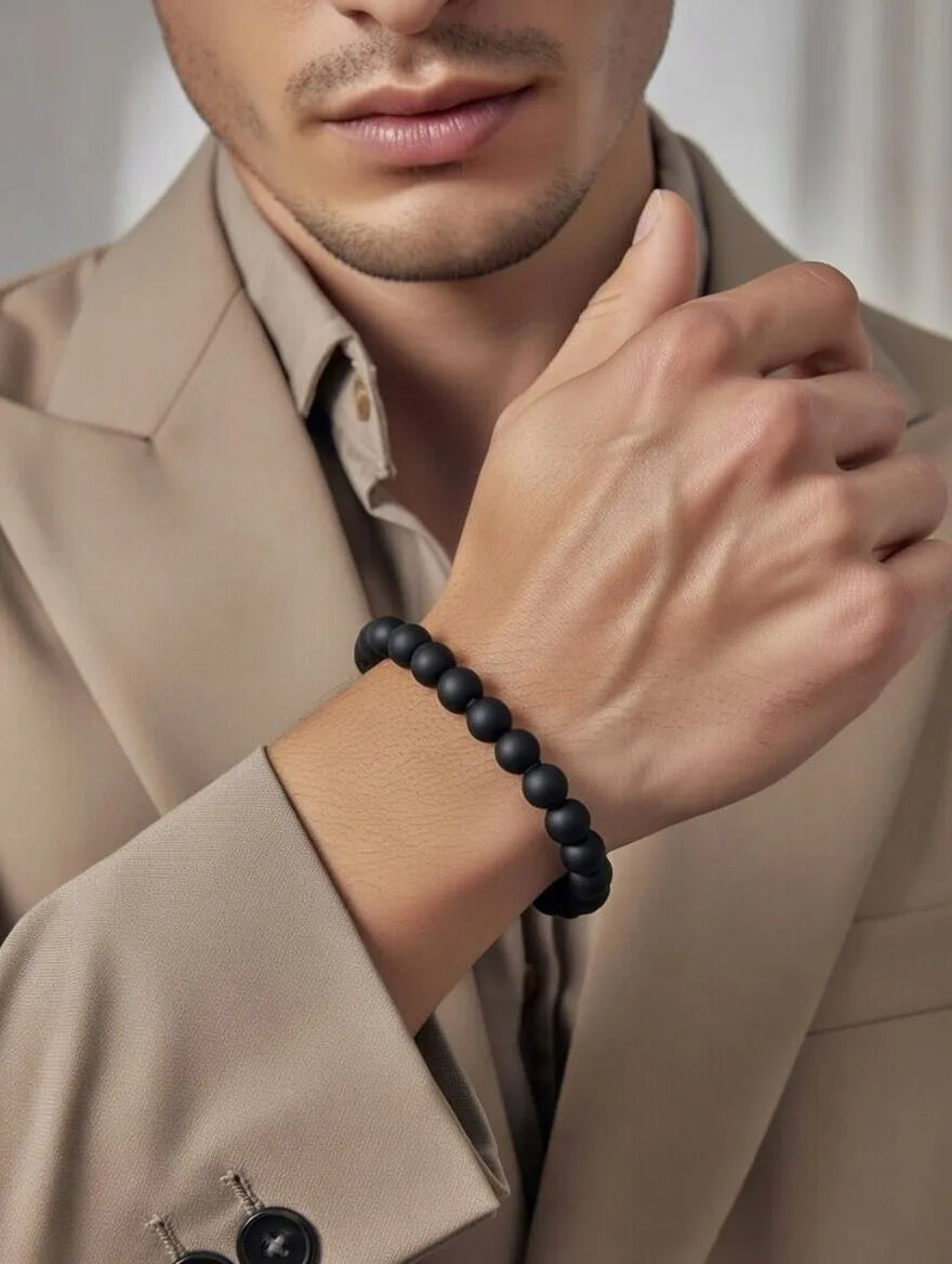 Unisex stretch bracelet featuring polished round black onyx beads
